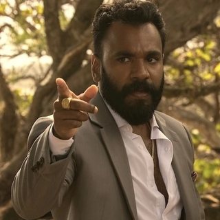 Carlos Singh as seen in the show, played by Andy McQueen